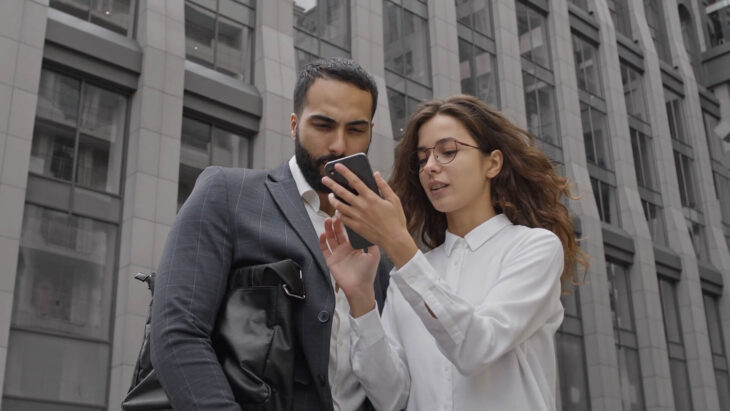 A woman discussing her business with a man