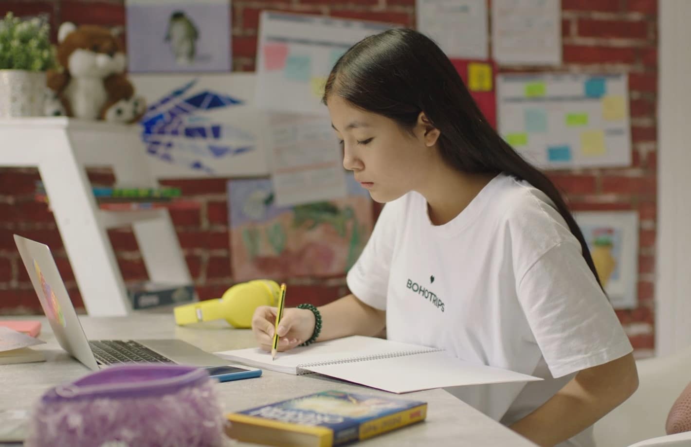 A girl learning a new language on laptop