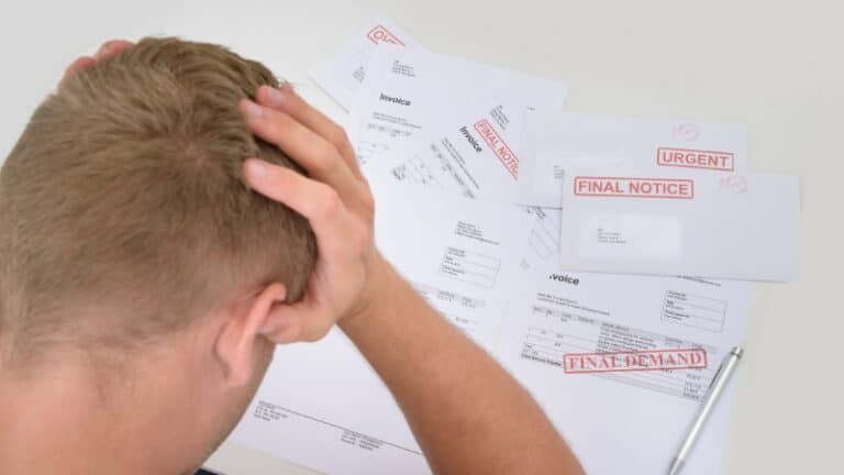 Man stressed over unpaid bills from clients ignoring your invoices