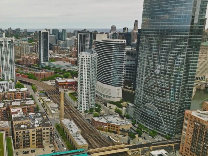Modern skyscrapers and elevated trains in downtown Chicago, illustrating high-density housing and rental market dynamics