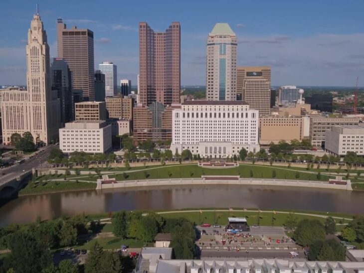 The government and business center of Columbus, Ohio, bordered by a calm riverbank