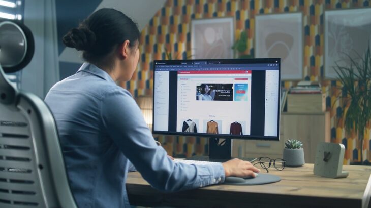 Woman working on product descriptions for an online store, adjusting content on a desktop computer screen