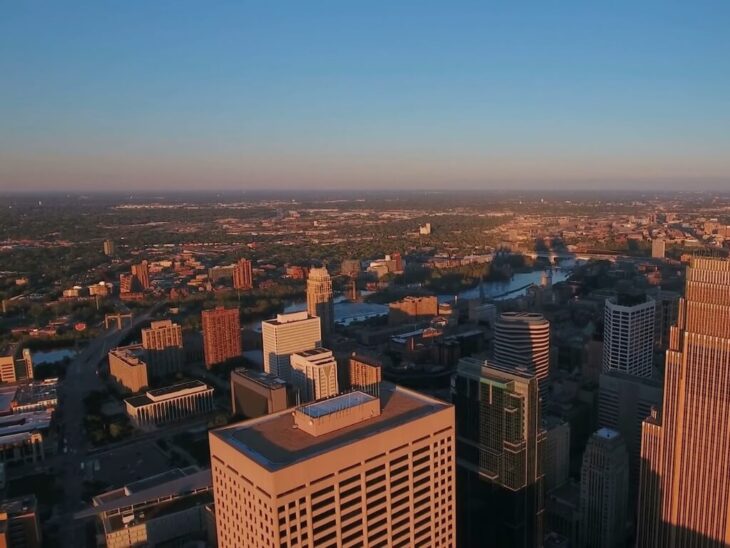 Sunset view of downtown Minneapolis with the Mississippi River cutting through the city