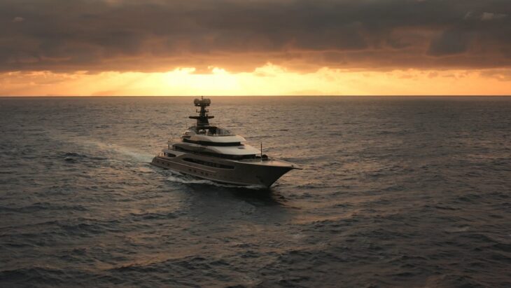 Luxury yacht cruising at sunset on the open sea