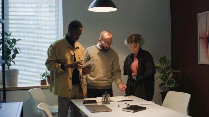 A collaborative team planning updates to a tiered loyalty program in a creative office environment