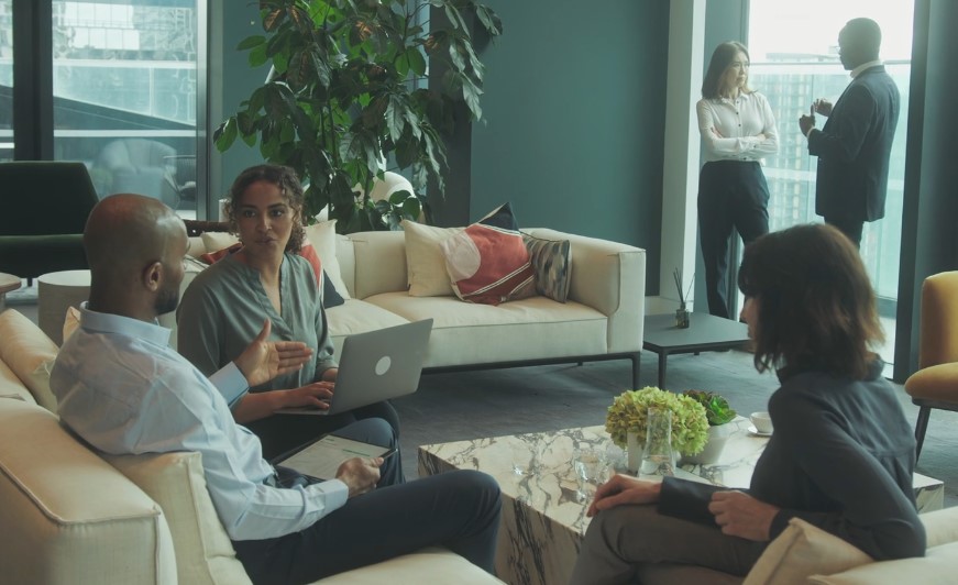 A diverse group engages in a collaborative discussion
