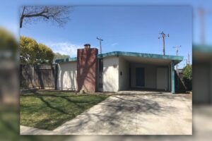 Single story house with a carport and minimal exterior upgrades before renovation